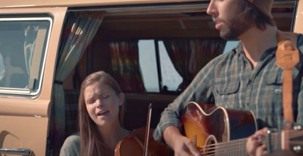 Pictured: Lydia Luce plays viola while sitting in a camper van