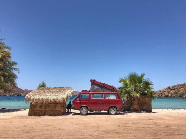 Pictured: front view of a red Westfalia van