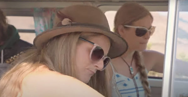 Pictured: the Shook Twins sitting inside a van wearing sunglasses