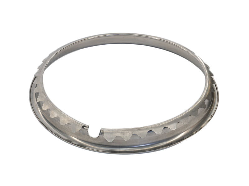 back side detail of chrome trim ring on white background 