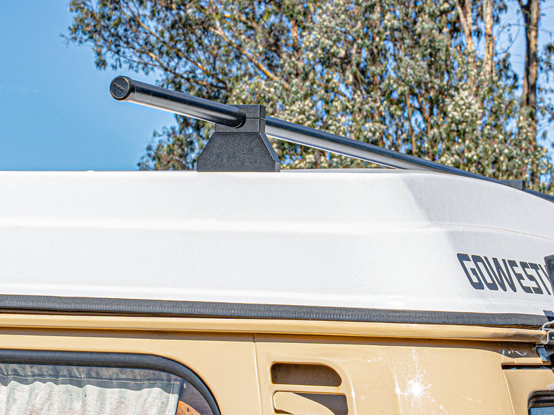 Roof rack on a vehicle with trees in the background