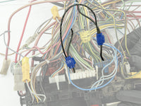 Thumbnail of Close-up of automotive wiring harness with connectors.